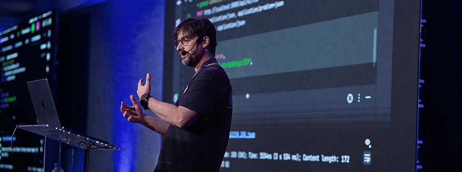 Ardan Labs Engineer on Stage at a Conference