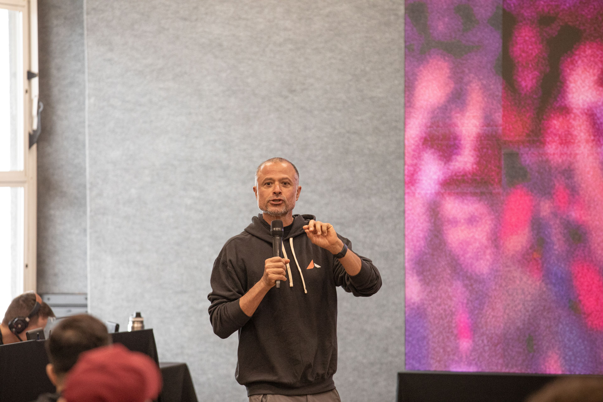 GopherCon LATAM 2026 — MJ opening the Ardan Labs workshop with a microphone in hand.