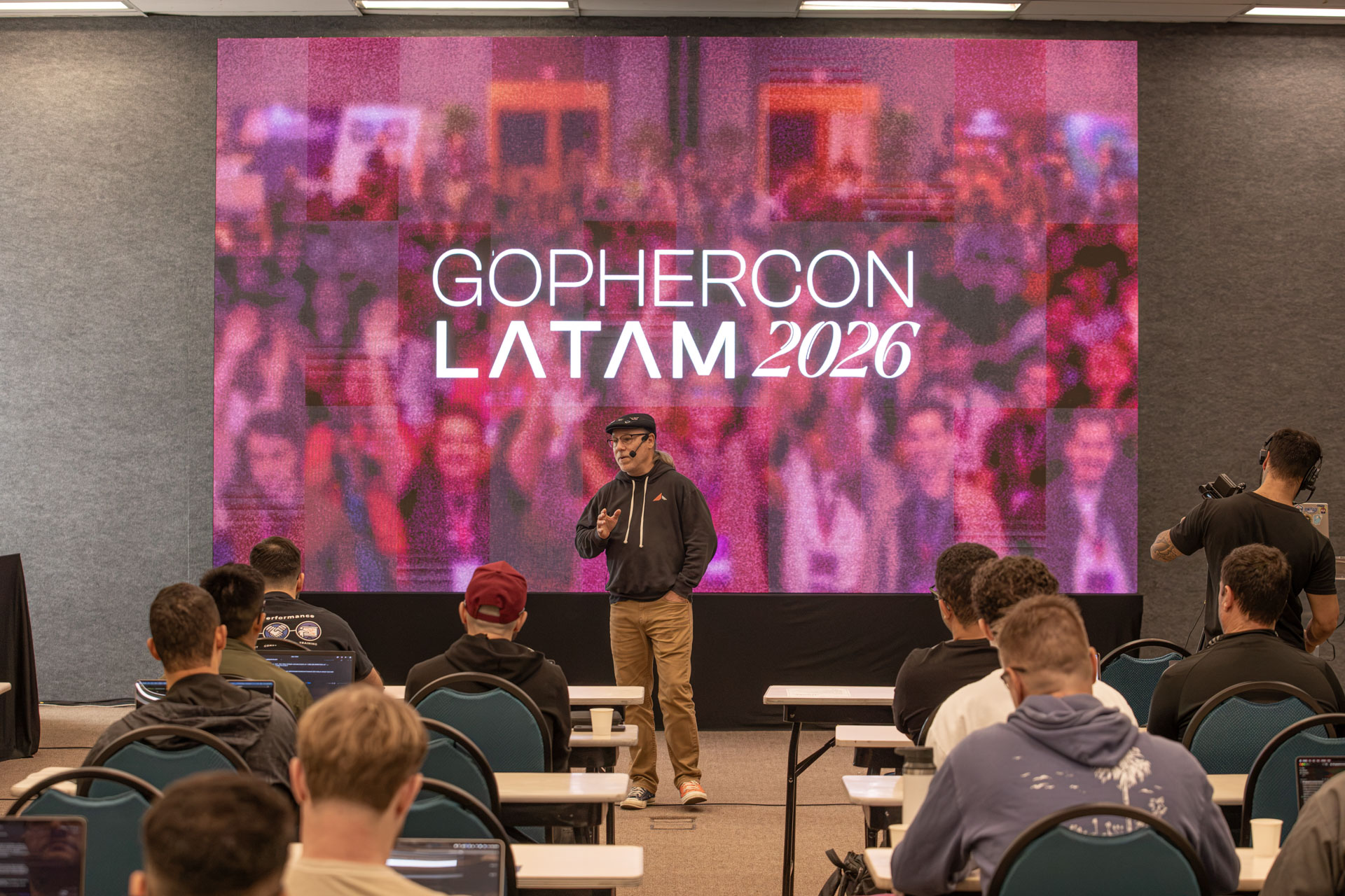 GopherCon LATAM 2026 — Bill Kennedy on stage in front of the event title screen.