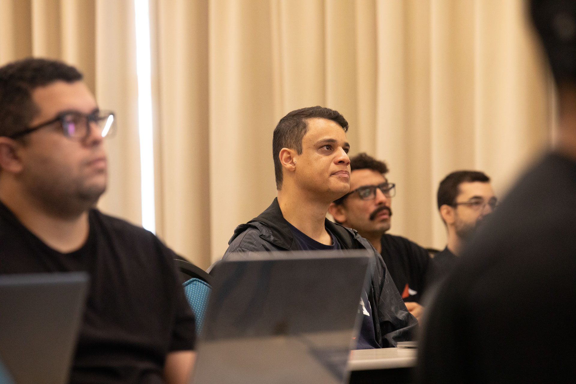 GopherCon LATAM 2026 — Go developers watching a session from the middle of the room.