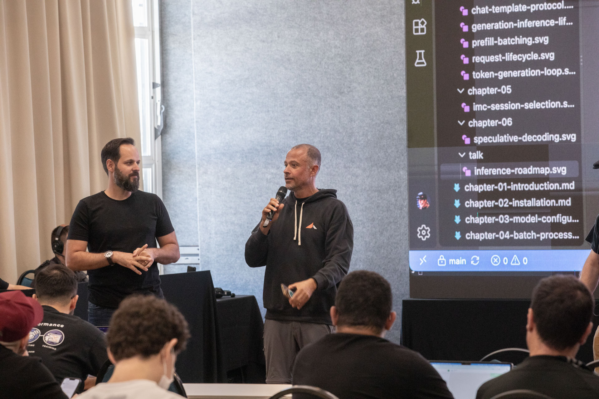 GopherCon LATAM 2026 — MJ answering a question alongside a co-presenter during the AI workshop.