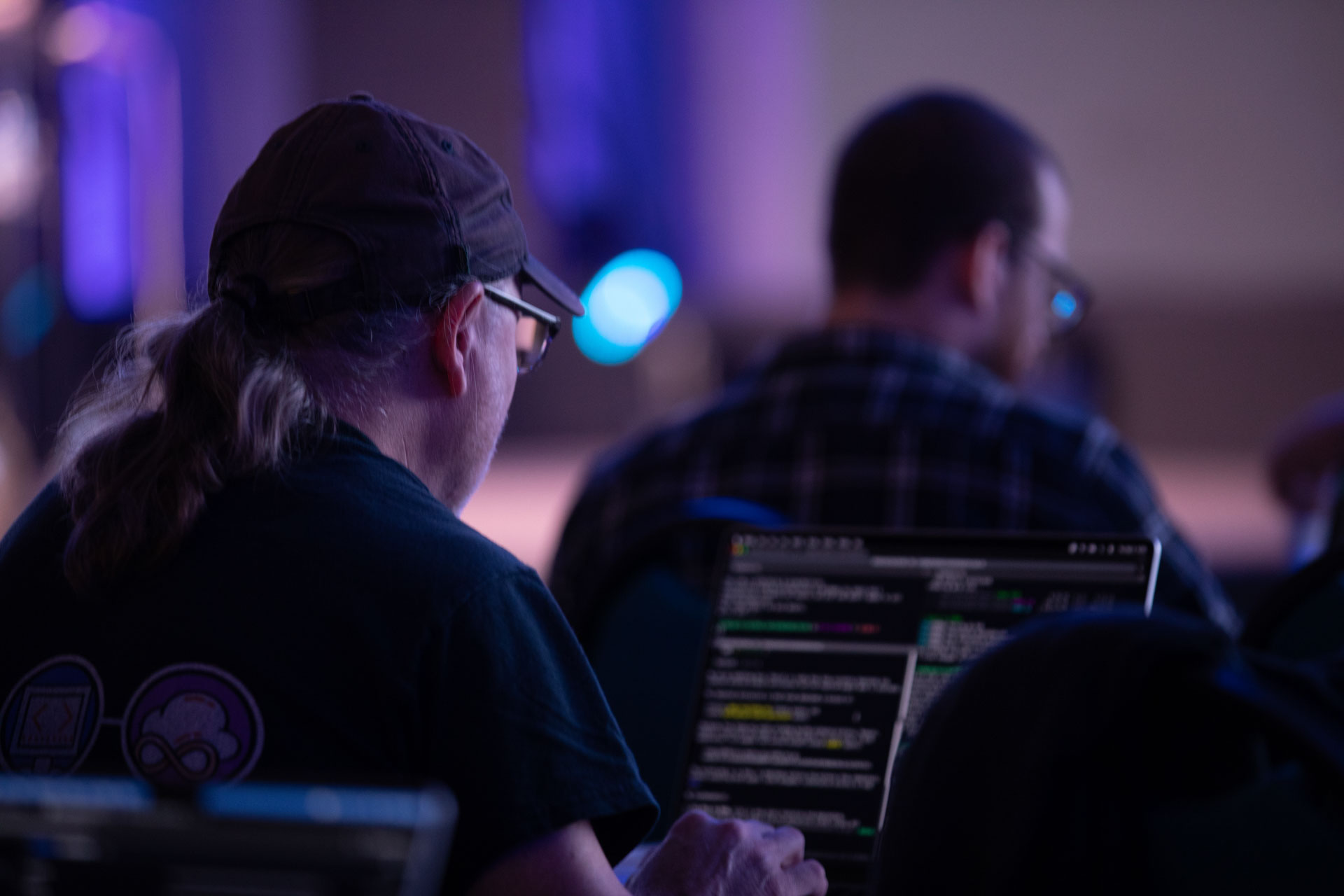 GopherCon LATAM 2026 — Bill Kennedy working through Go code on his laptop during a talk.