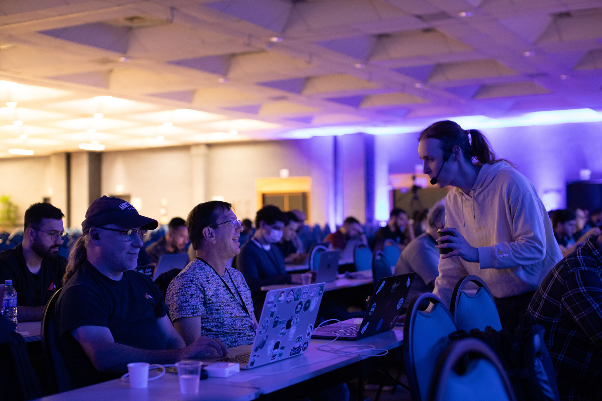GopherCon LATAM 2026 — Bill Kennedy in conversation at the back of the main ballroom.