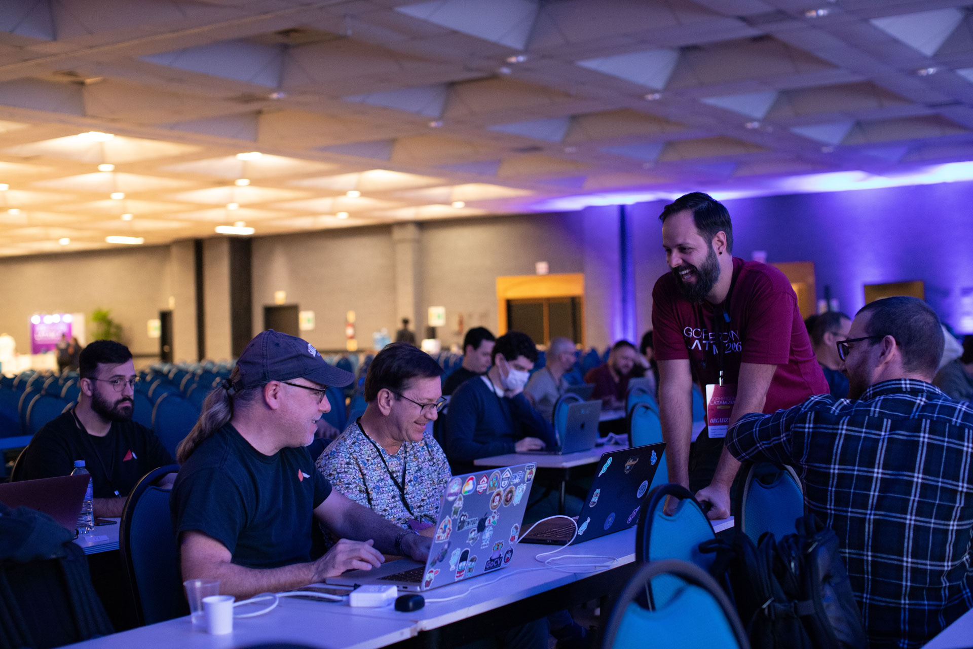 GopherCon LATAM 2026 — Bill Kennedy laughing with an organizer in a GopherCon LATAM shirt.