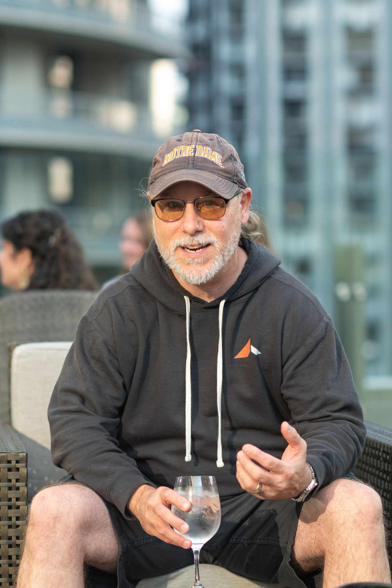 GopherCon US 2026 — Bill Kennedy talking with attendees at the Ardan Labs rooftop meetup.