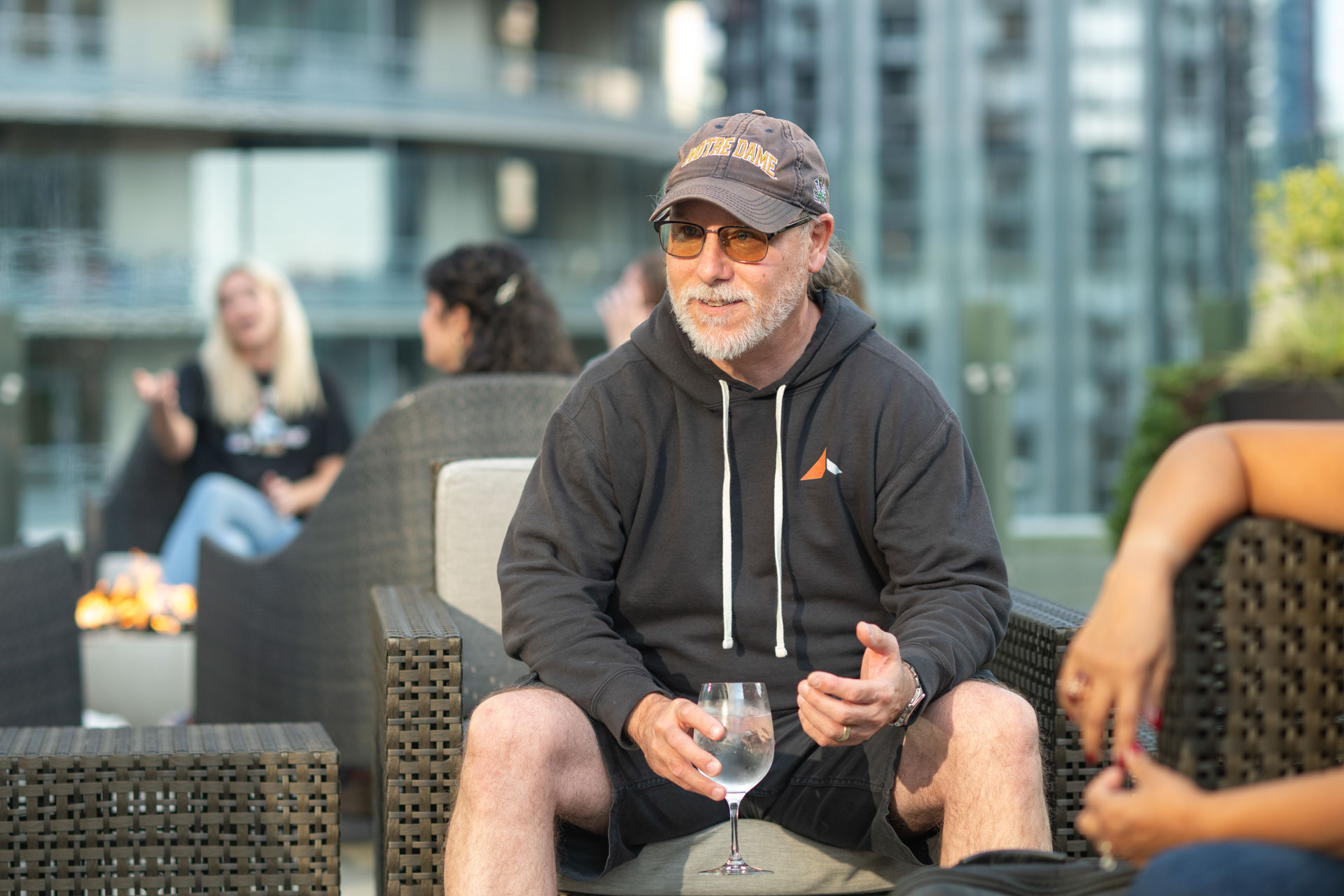 GopherCon US 2026 — Bill Kennedy sharing a story with Gophers on the rooftop patio.