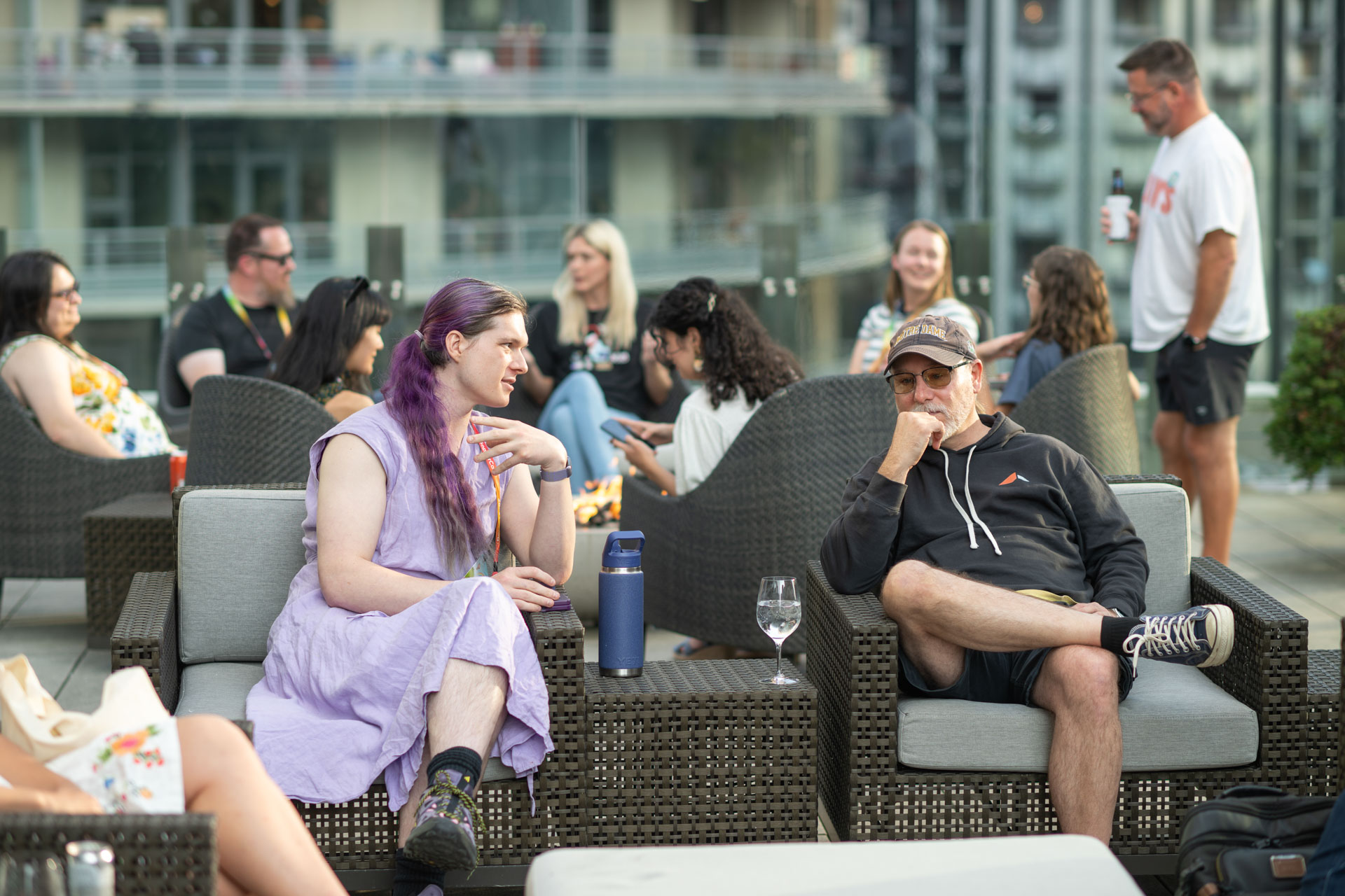 GopherCon US 2026 — attendees relaxing in lounge chairs at the rooftop community meetup.