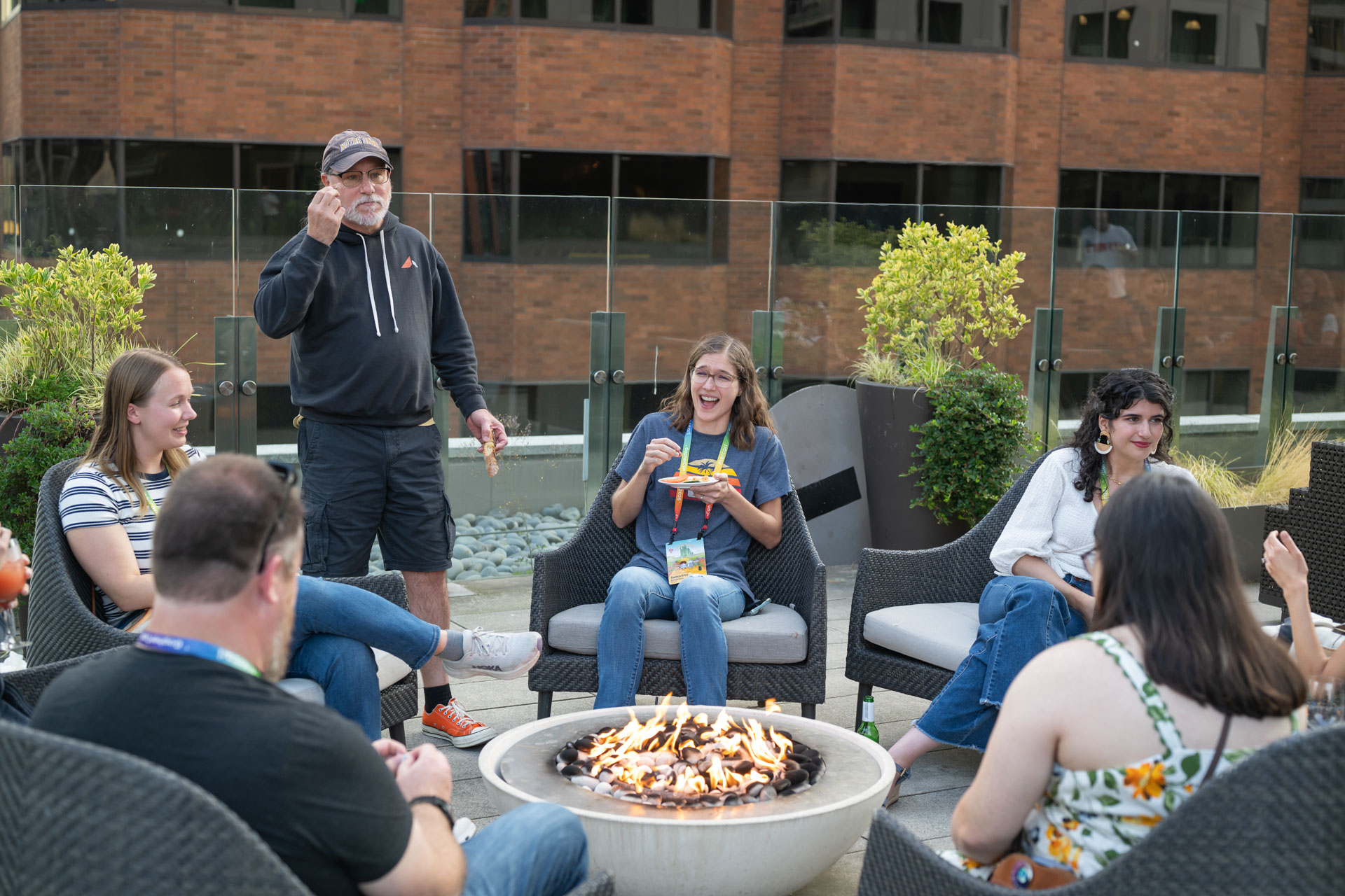 GopherCon US 2026 — attendees roasting marshmallows at the fire pit with Bill Kennedy.