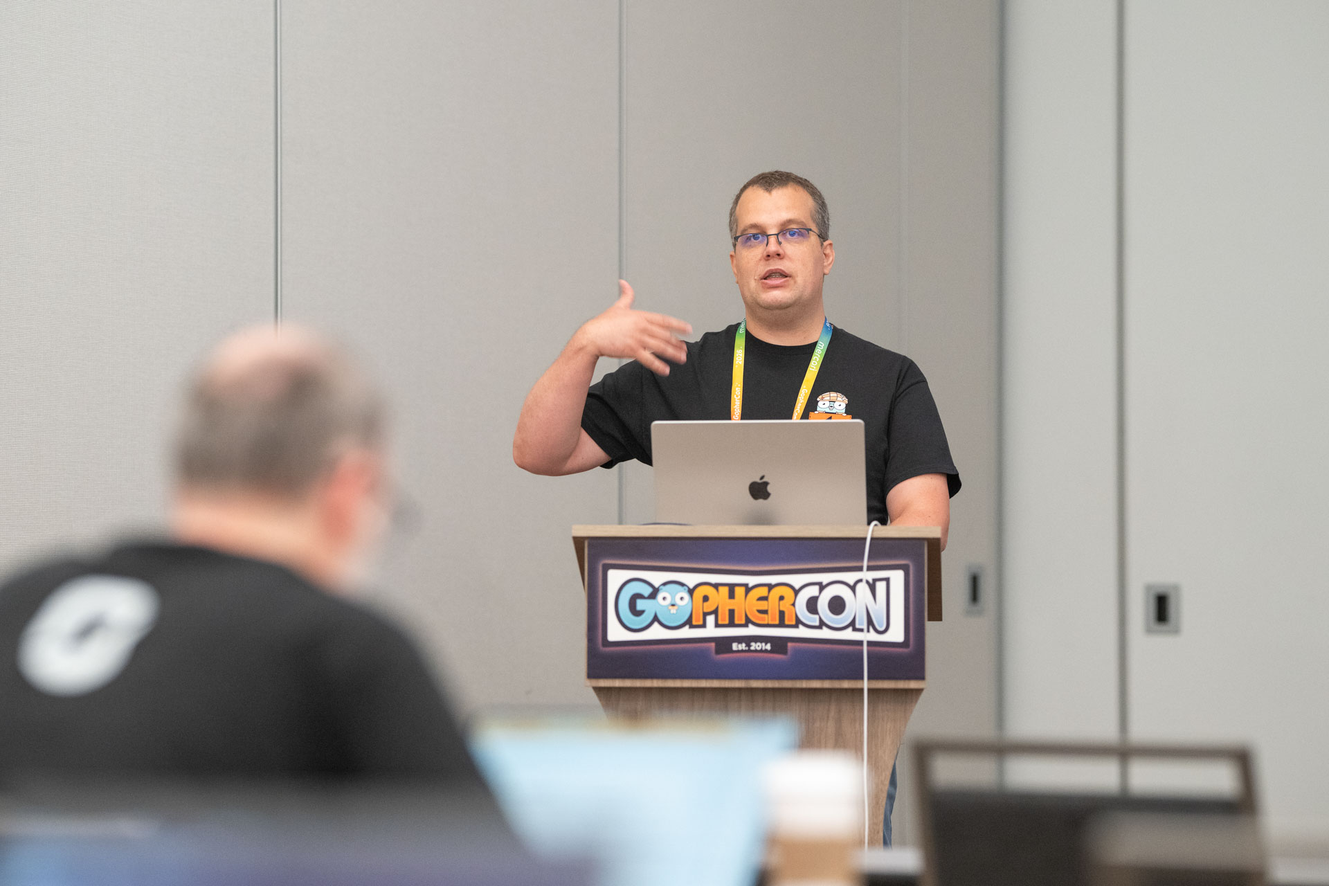 GopherCon US 2026 — Florin Pățan teaching from the workshop podium.