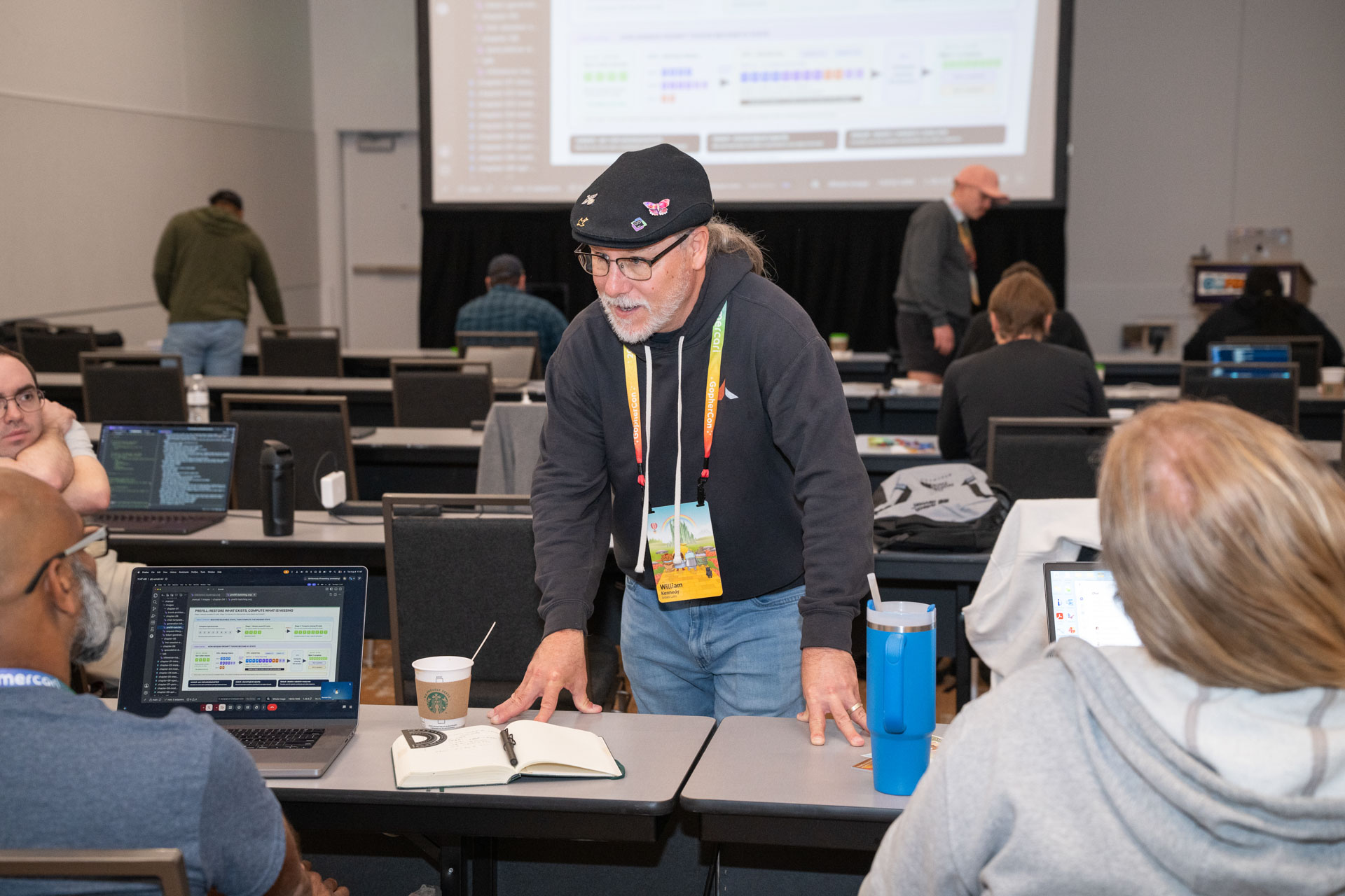 GopherCon US 2026 — Bill Kennedy helping attendees one-on-one between exercises.