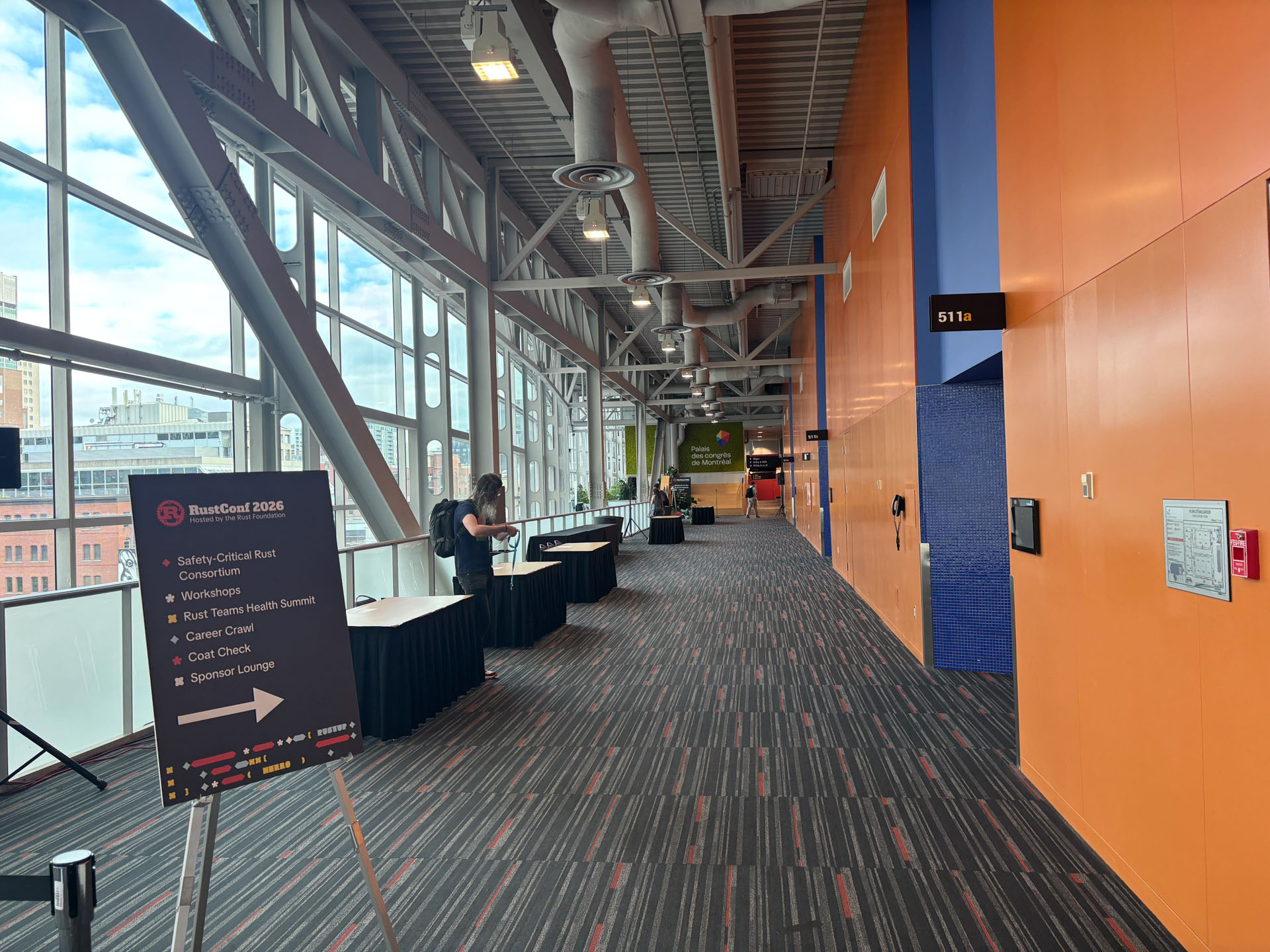 RustConf 2026 — a wayfinding sign pointing to the workshops and the Rust Teams Health Summit.