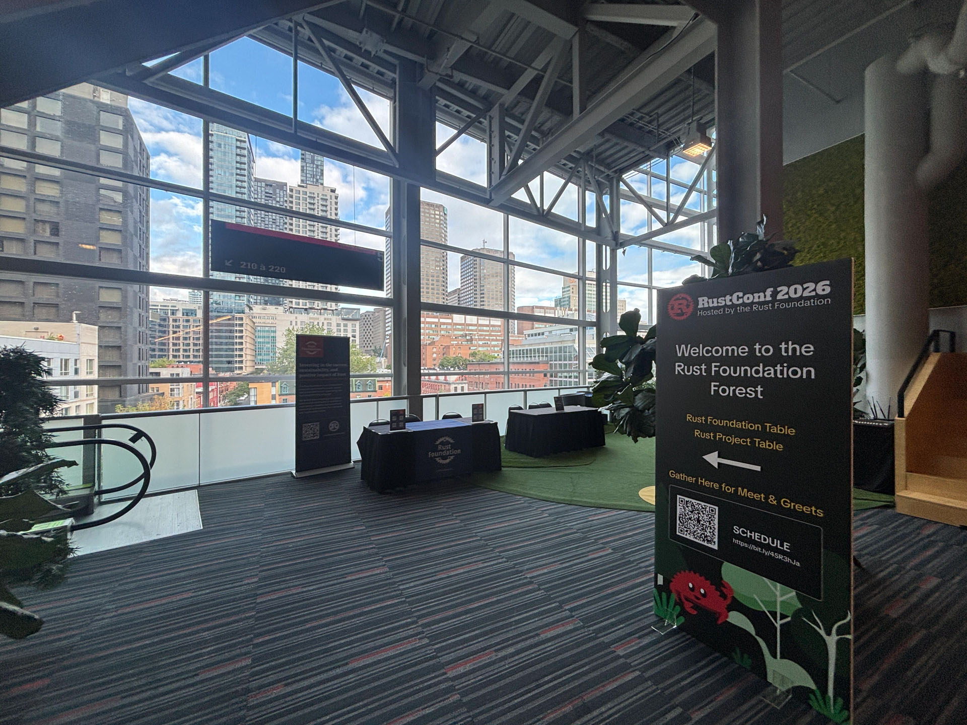RustConf 2026 — the Rust Foundation Forest lounge set up for meet and greets.