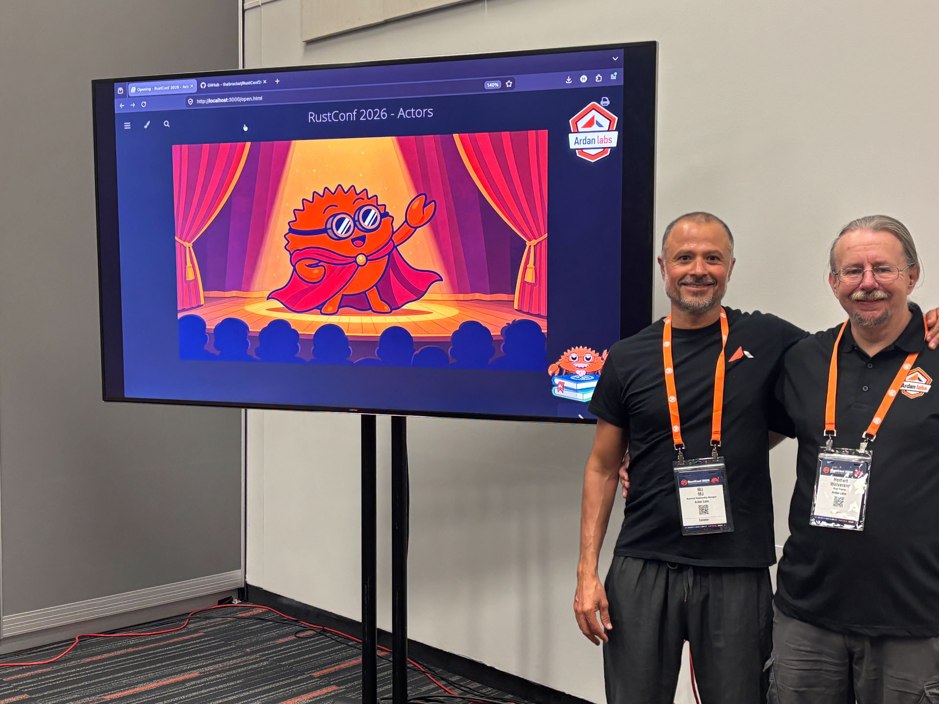RustConf 2026 — MJ and Herbert Wolverson next to the RustConf 2026 Actors title slide.