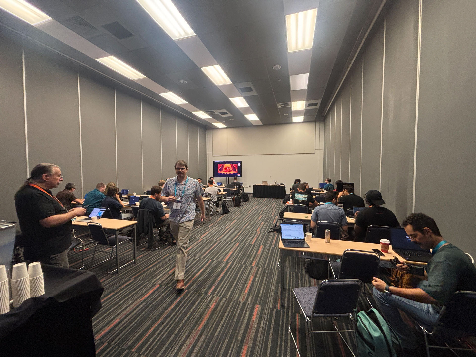 RustConf 2026 — attendees settling in with laptops as the async Rust workshop gets underway.