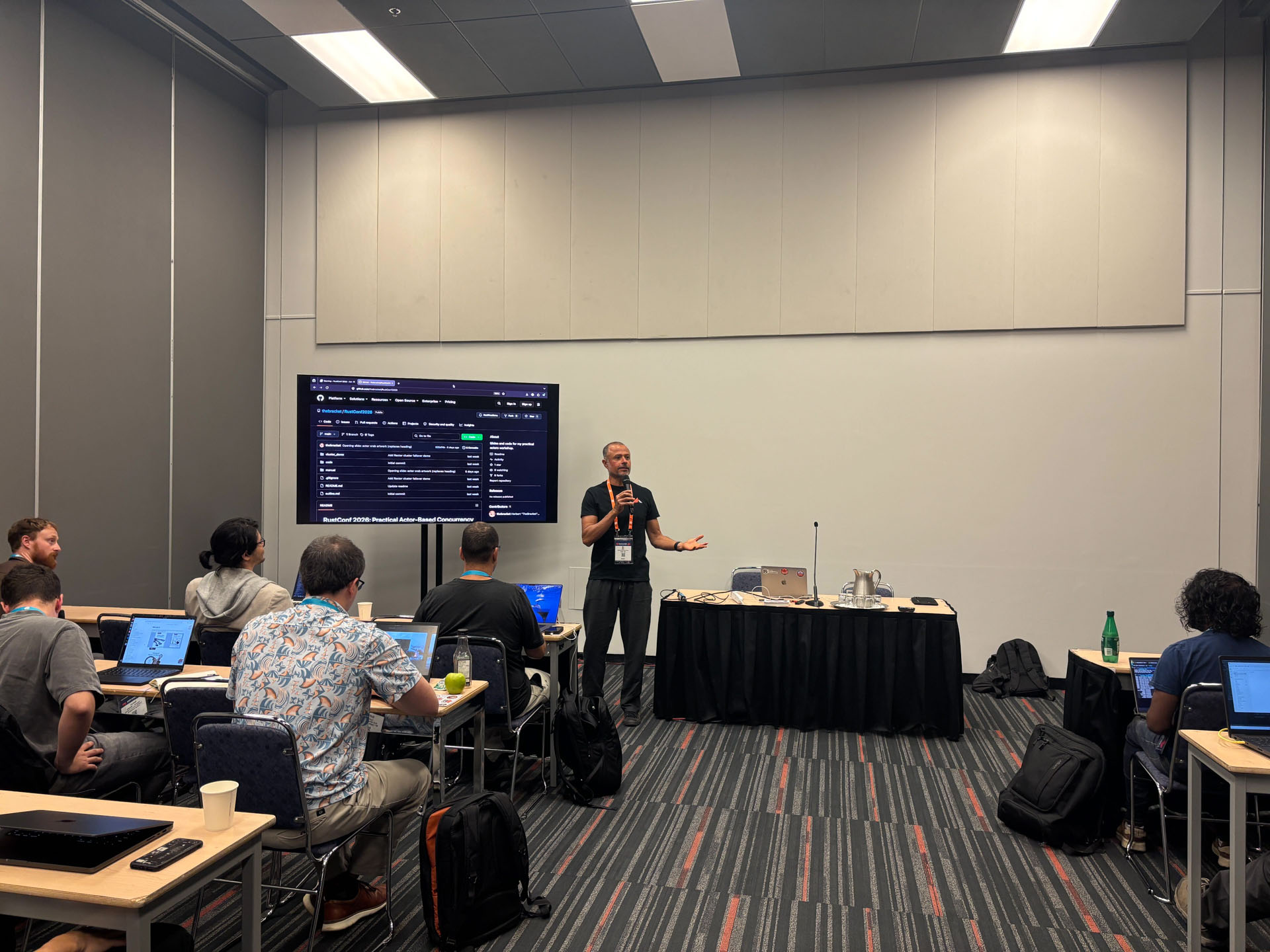 RustConf 2026 — MJ teaching async Rust fundamentals to workshop attendees.