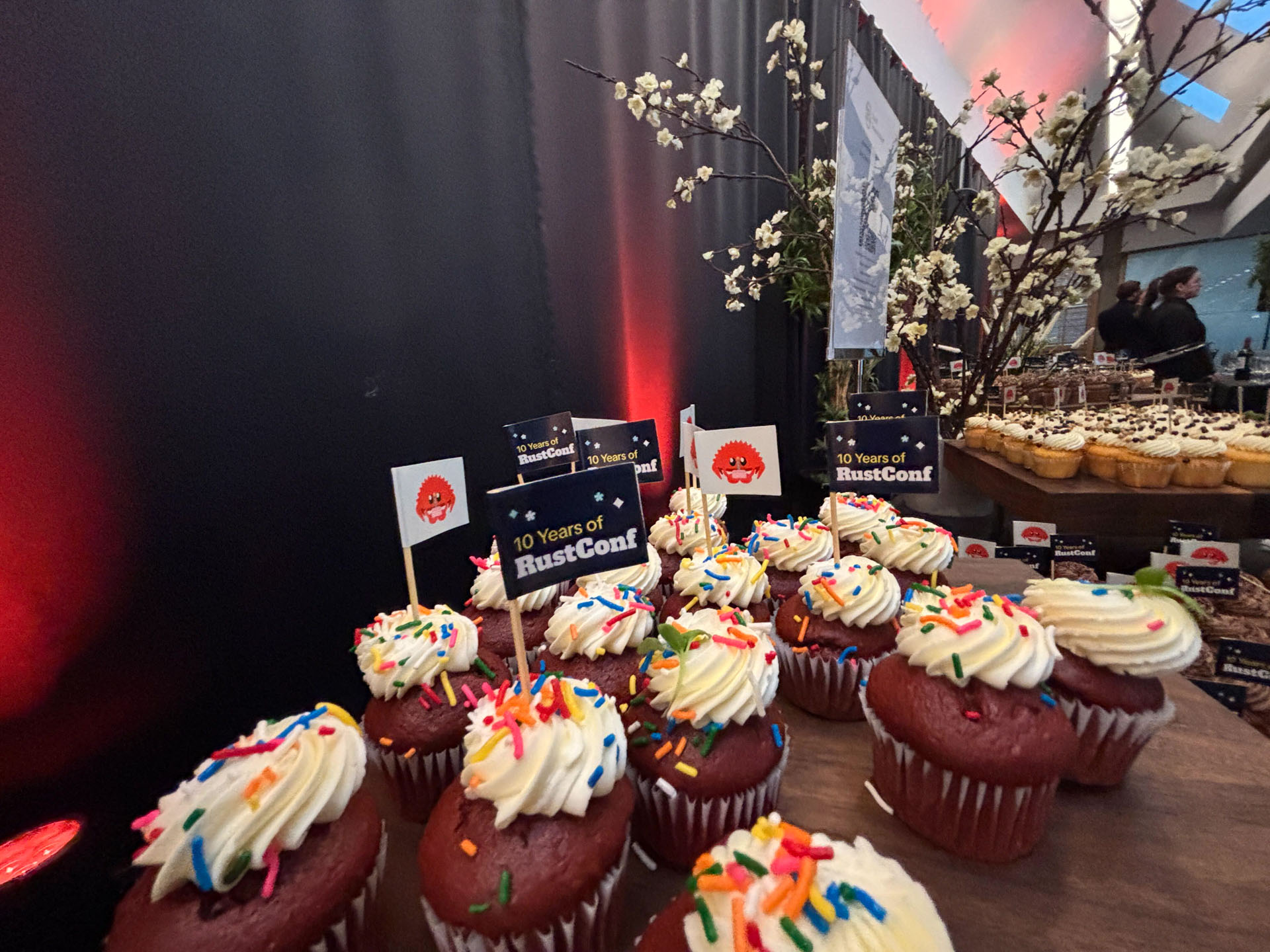 RustConf 2026 — cupcakes topped with 10 Years of RustConf flags.