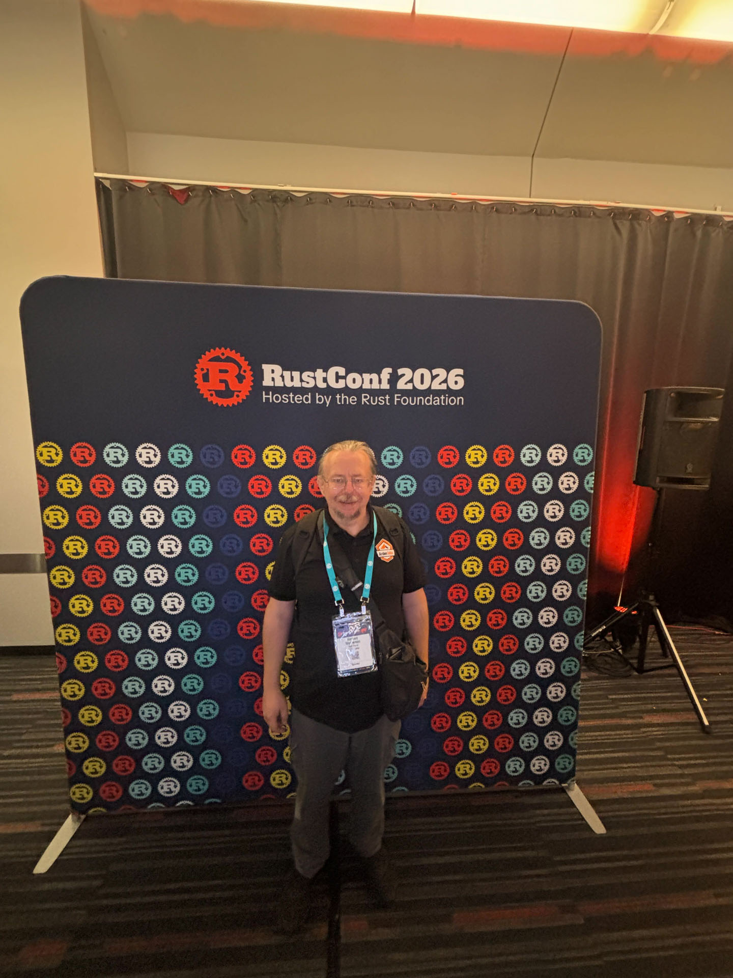RustConf 2026 — Herbert Wolverson in front of the RustConf 2026 photo backdrop.
