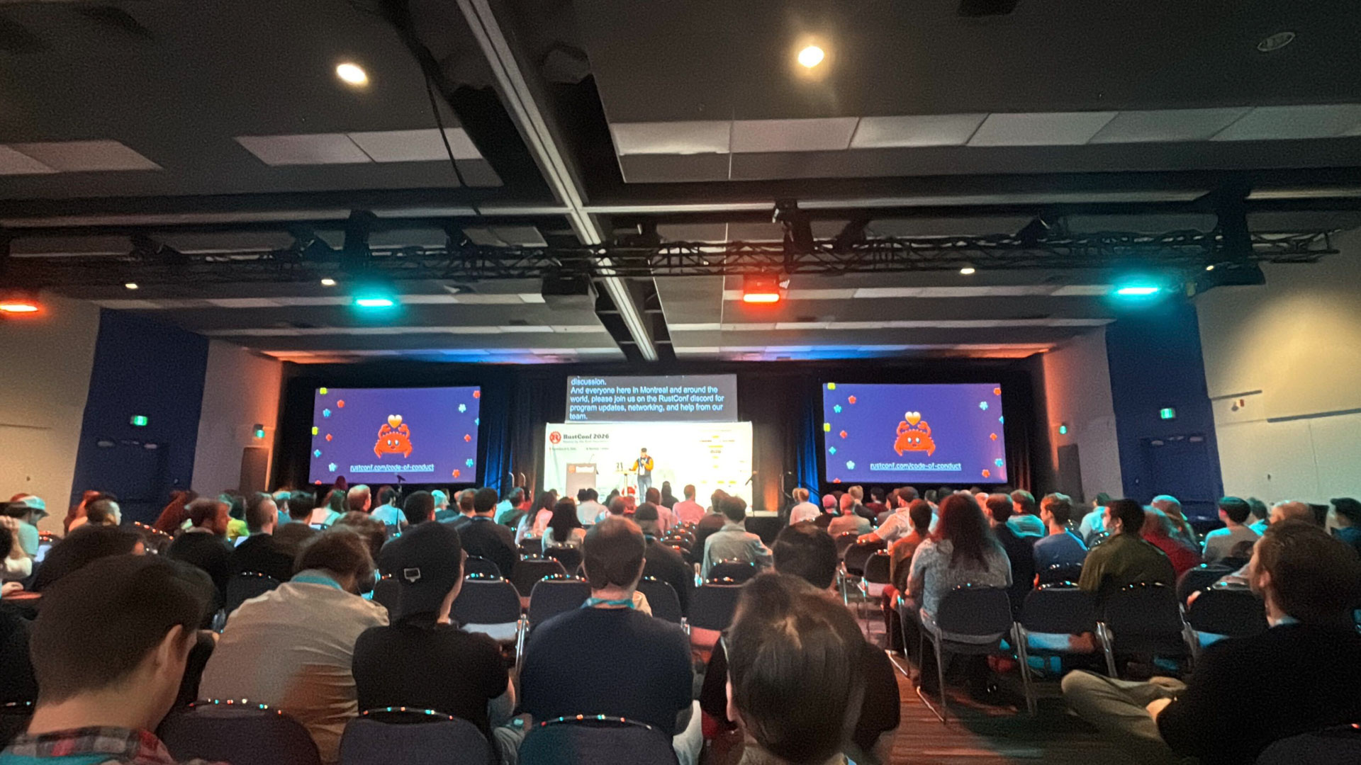 RustConf 2026 — the code of conduct reminder shown before a main stage talk.