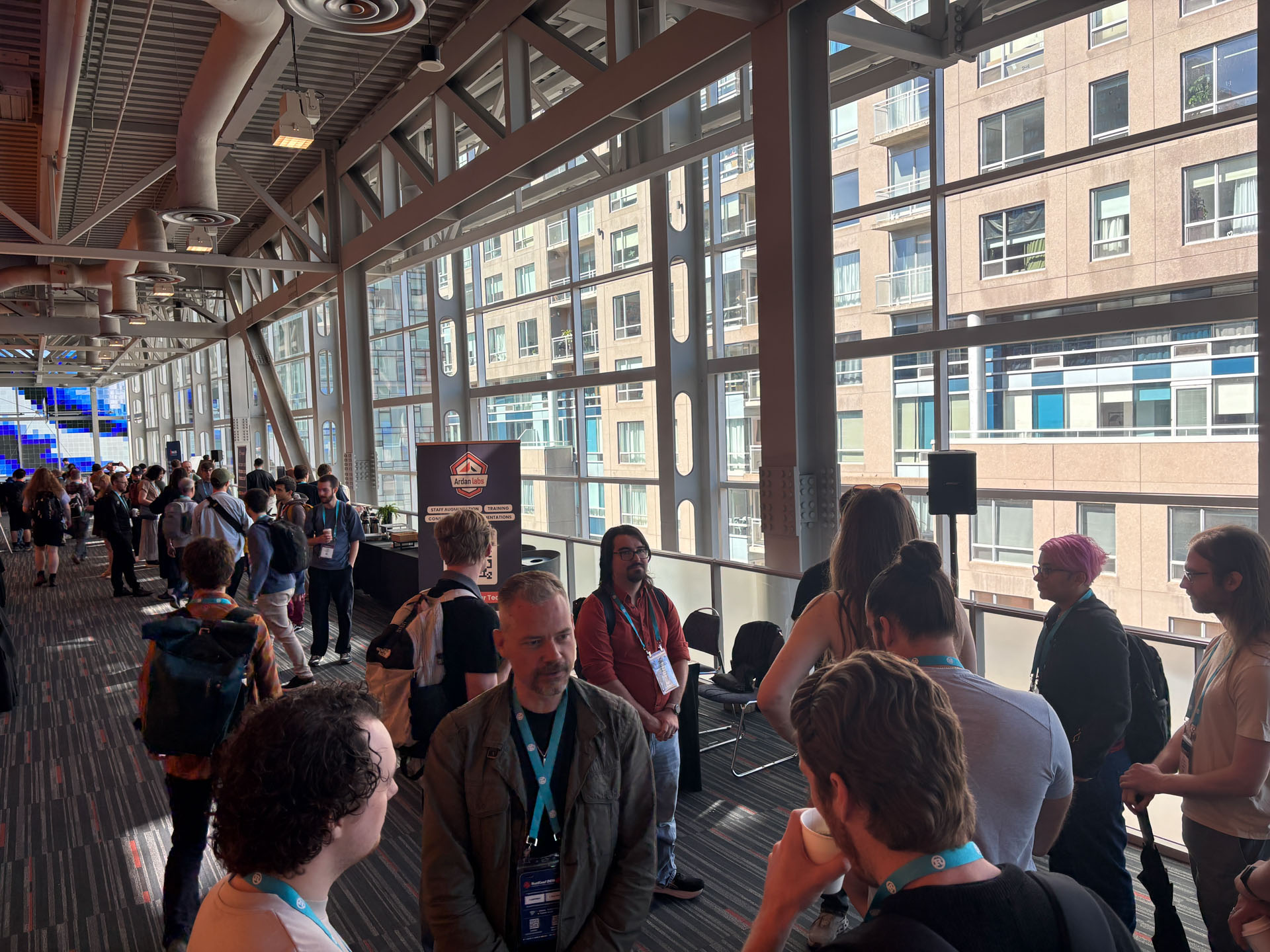 RustConf 2026 — Rust community members chatting during a break between talks.