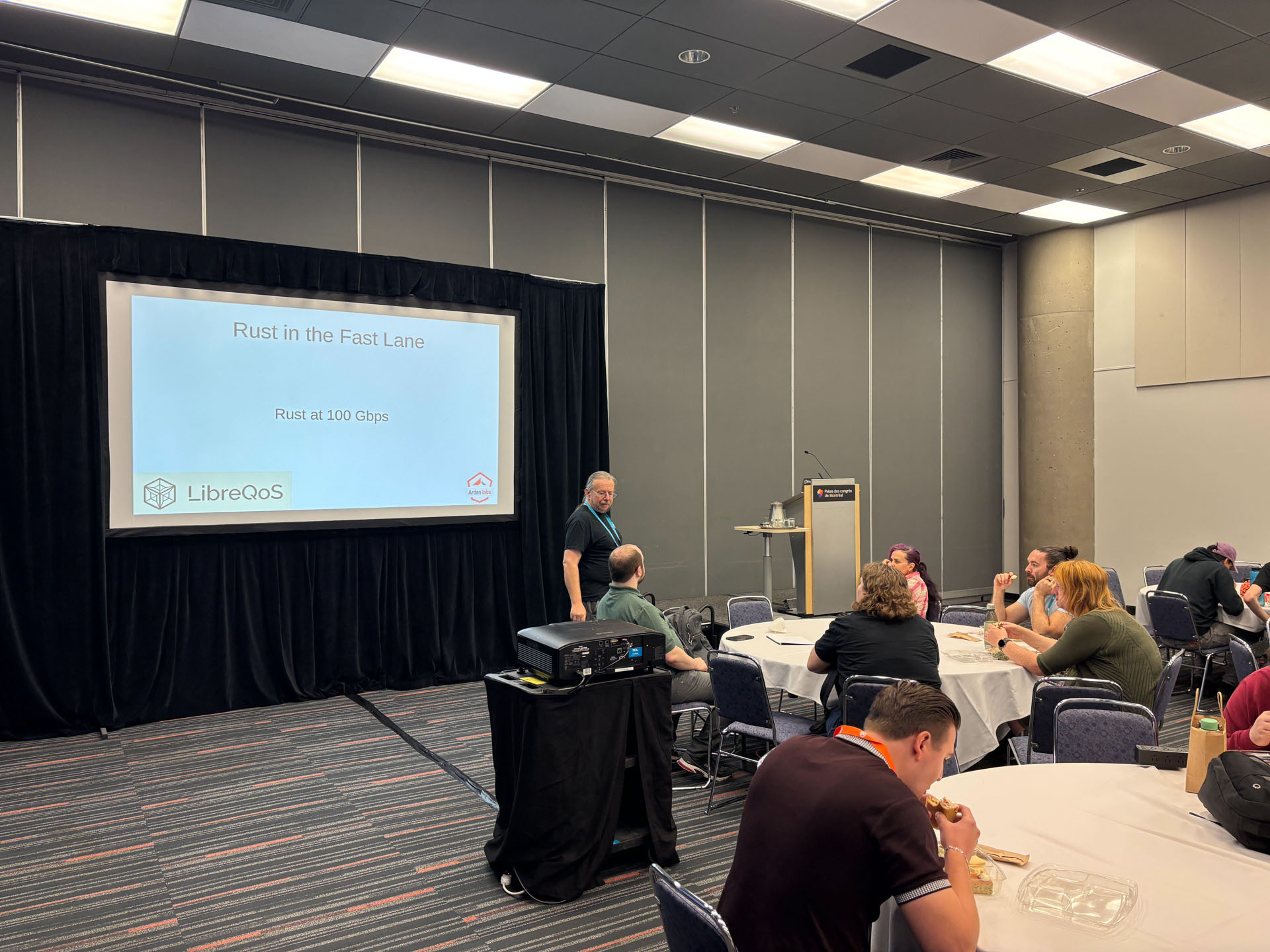 RustConf 2026 — Herbert Wolverson opening his Rust in the Fast Lane talk.