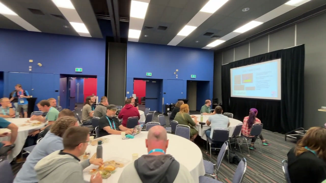 RustConf 2026 — the community room audience during a lunchtime session.