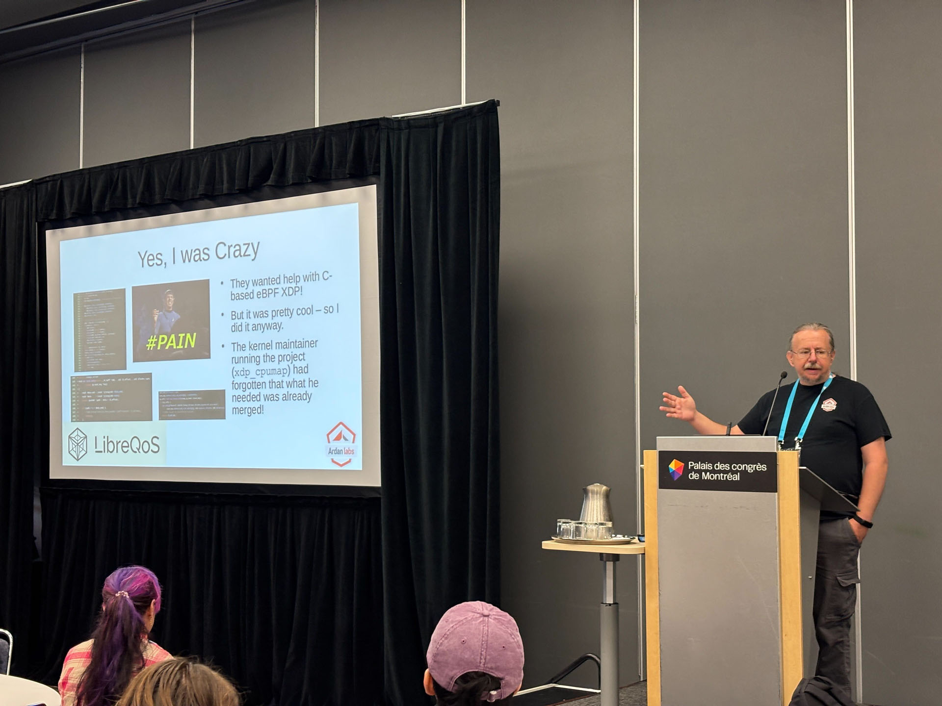 RustConf 2026 — Herbert Wolverson presenting a slide on pushing Rust to 100 Gbps.