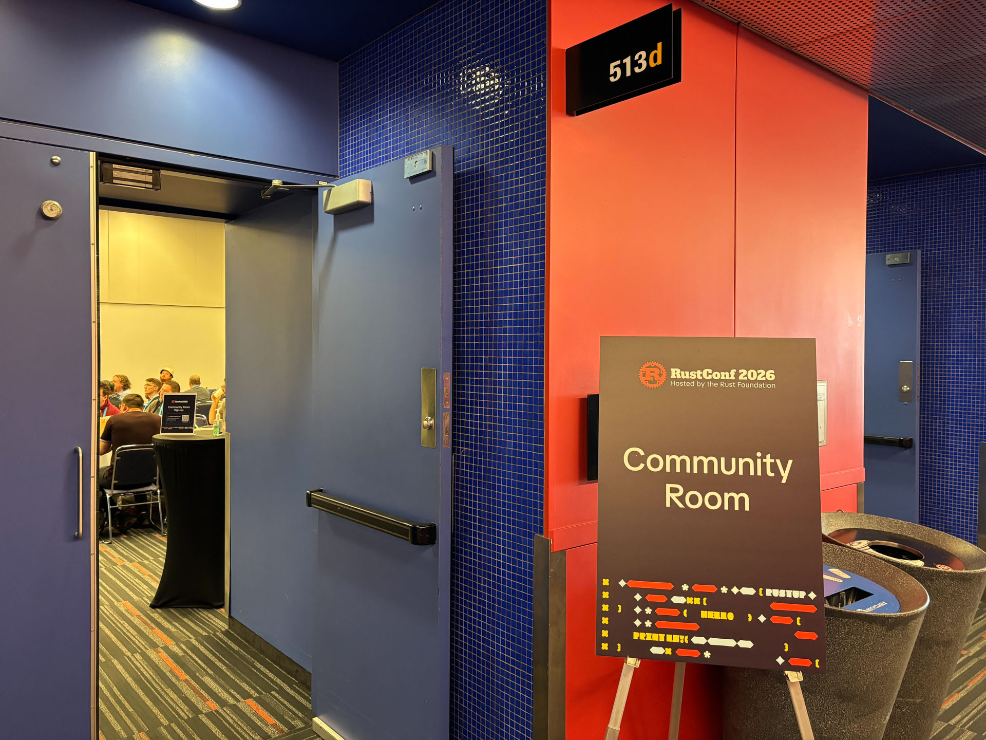 RustConf 2026 — the Community Room sign outside the session room.