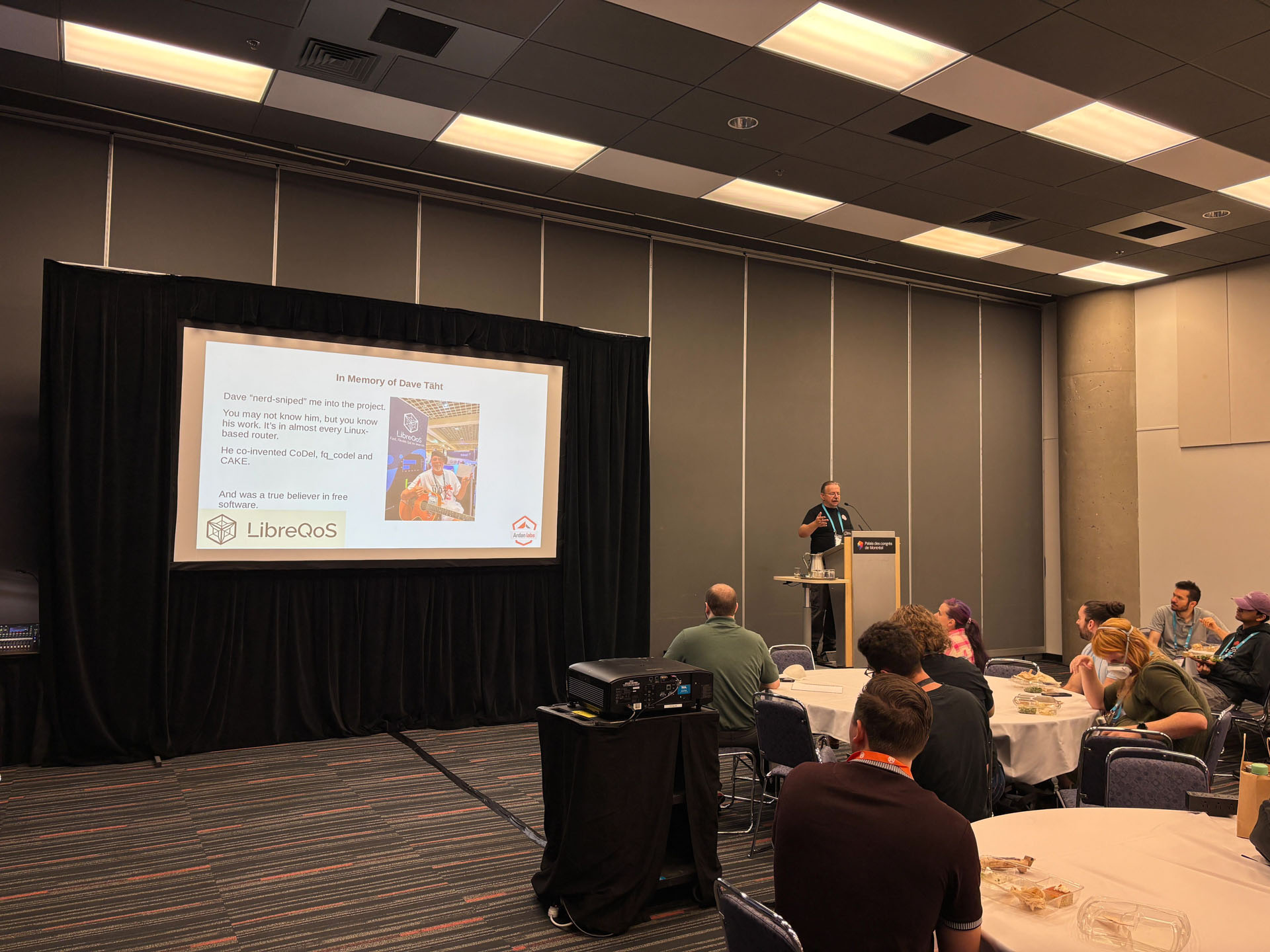 RustConf 2026 — Herbert Wolverson honoring a contributor during his Rust networking talk.