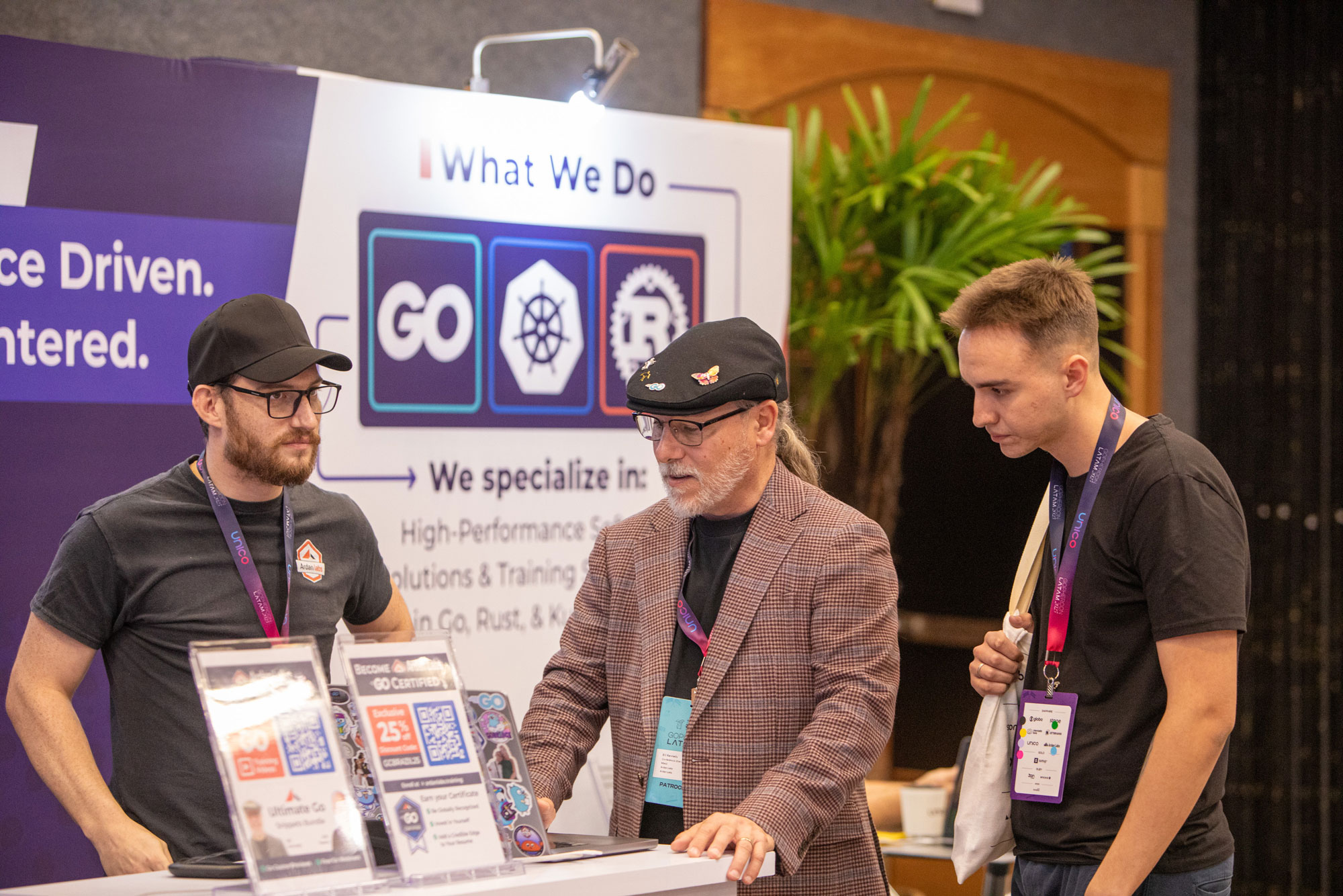 Group photo of community members and organizers at an outdoor conference gathering
