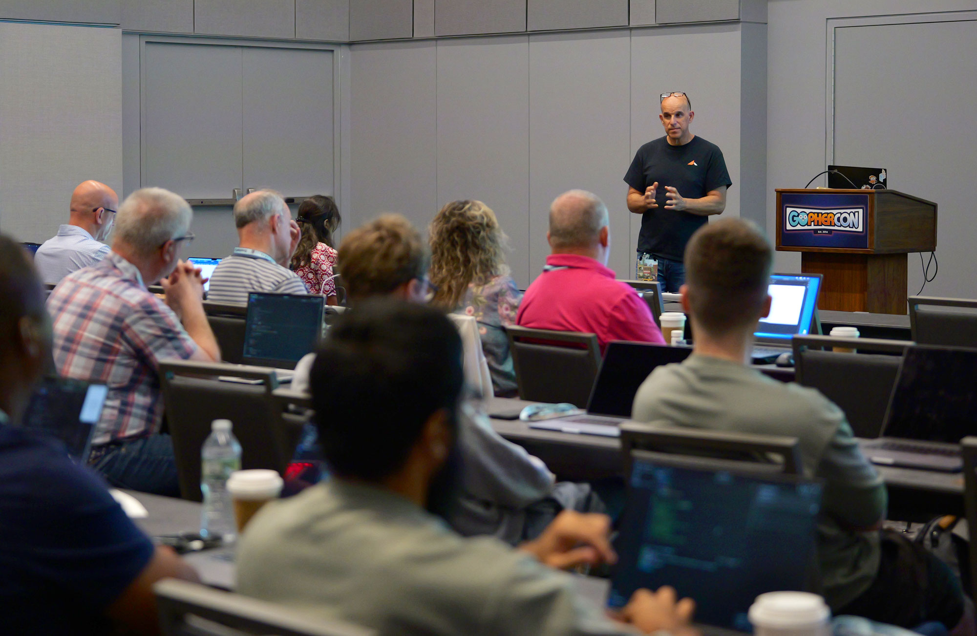 Workshop at GopherCon: speaker at the front of the room with developers on laptops at tables